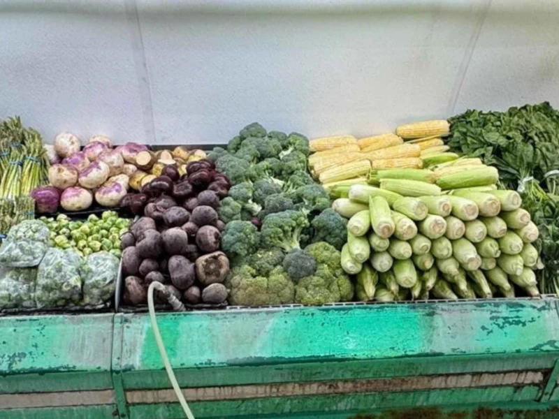 Beets, broccoli, squash and corn stacked on the produce stand at Butcher & Farmer Market in Buckeye, AZ.