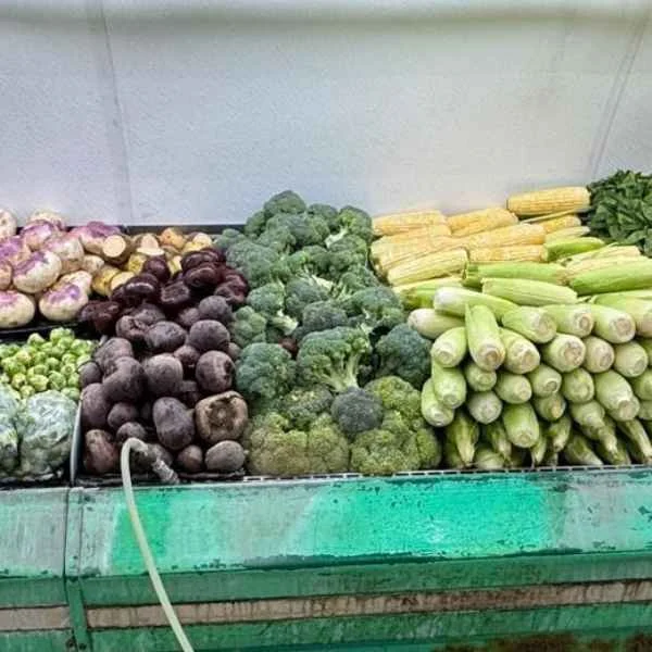 Beets, broccoli, squash and corn stacked on the produce stand at Butcher & Farmer Market in Buckeye, AZ.