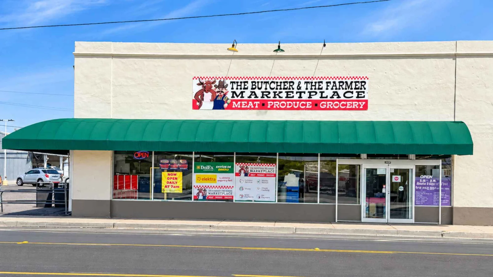 Butcher & Farmer Market storefront with green awning, sign and front entrance in Buckeye, AZ.