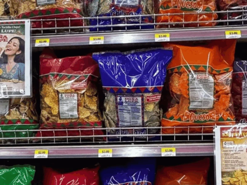 Snack aisle with Doña Lupe tortilla chips and a Doña Lupe display at Del Sol in San Luis, AZ