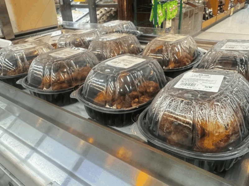 Hot rotisserie chickens ready to go in the deli case at Del Sol Market San Luis East in San Luis, AZ