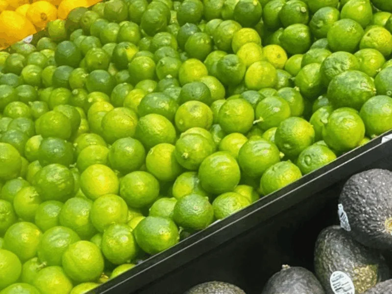 Fresh limes and avocados in the produce department at Del Sol Market San Luis East in San Luis, AZ