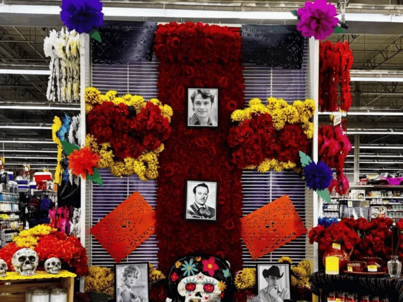 Día de los Muertos ofrenda with marigolds and photos at Del Sol Market in San Luis, AZ