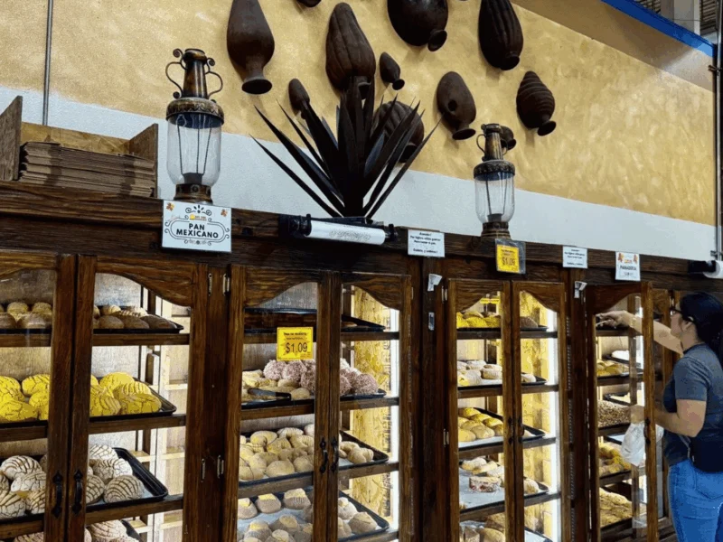 Panadería display cases filled with fresh pan dulce at Del Sol Market in San Luis, AZ