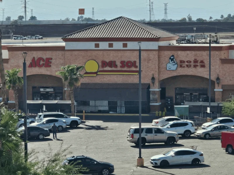 Del Sol Market storefront with Ace Hardware and palm trees in San Luis, AZ