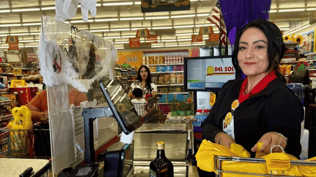 Smiling cashier at the checkout lane at Del Sol on 4th Avenue in Yuma, AZ