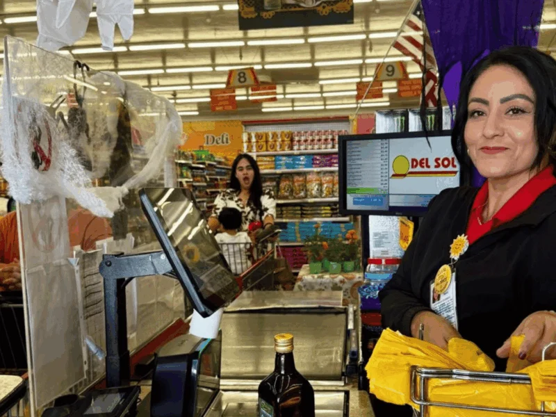 Smiling cashier at the checkout lane at Del Sol on 4th Avenue in Yuma, AZ