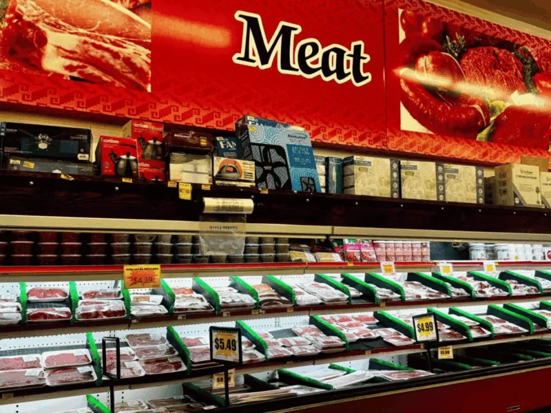 Meat department with fresh cuts in a long refrigerated case at Del Sol on 4th Avenue in Yuma, AZ