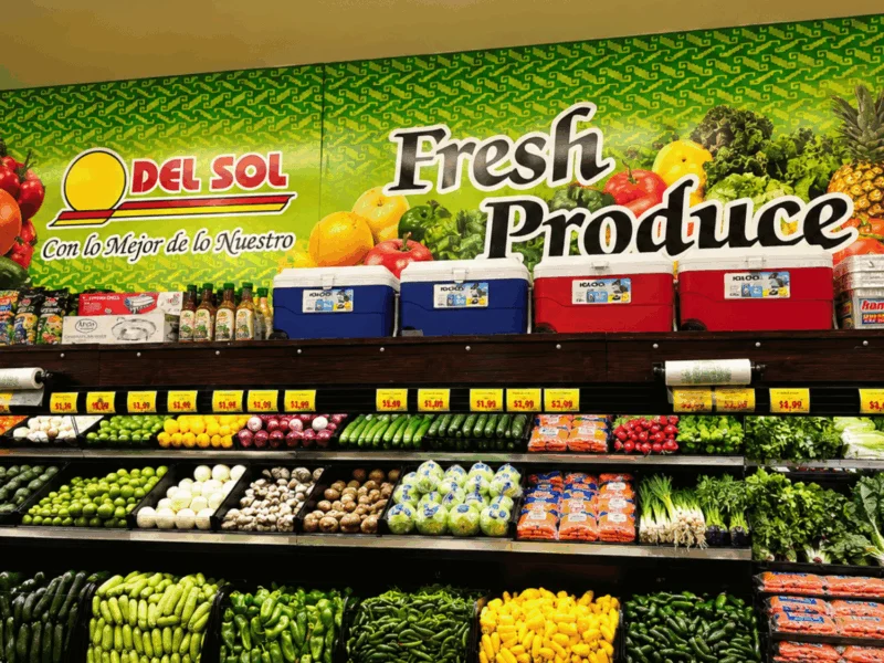 Fresh Produce department with a colorful wall mural and vegetables at Del Sol on 4th Avenue in Yuma, AZ