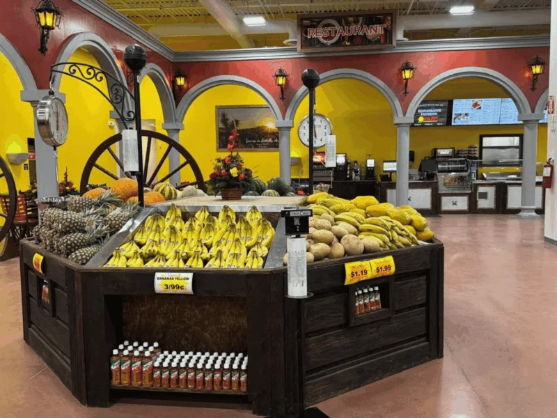 Produce department with a banana display and hacienda-style décor at Del Sol in the Yuma Foothills, AZ