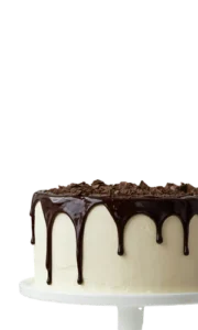 Cake with white frosting and chocolate drip