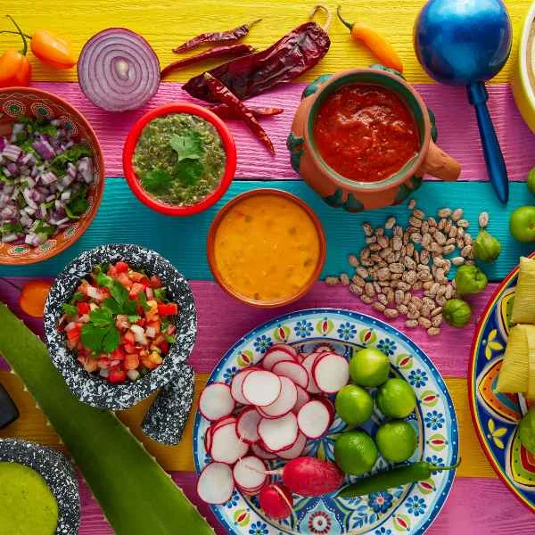 Mexican ingredients with salsas, chiles, radishes and limes