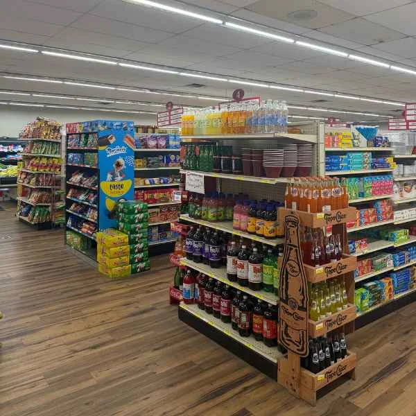 Grocery aisle with sports drinks, sodas and snack displays at Food Town IGA in Eloy