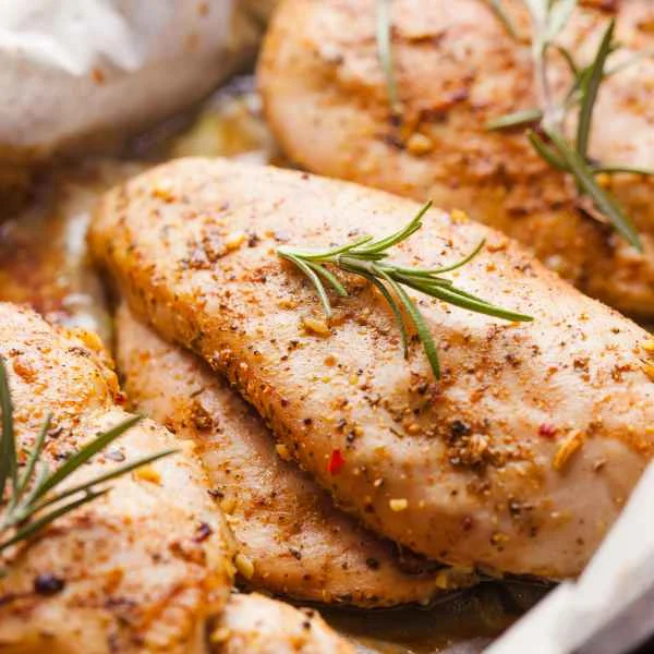 Seasoned roasted chicken breasts with rosemary