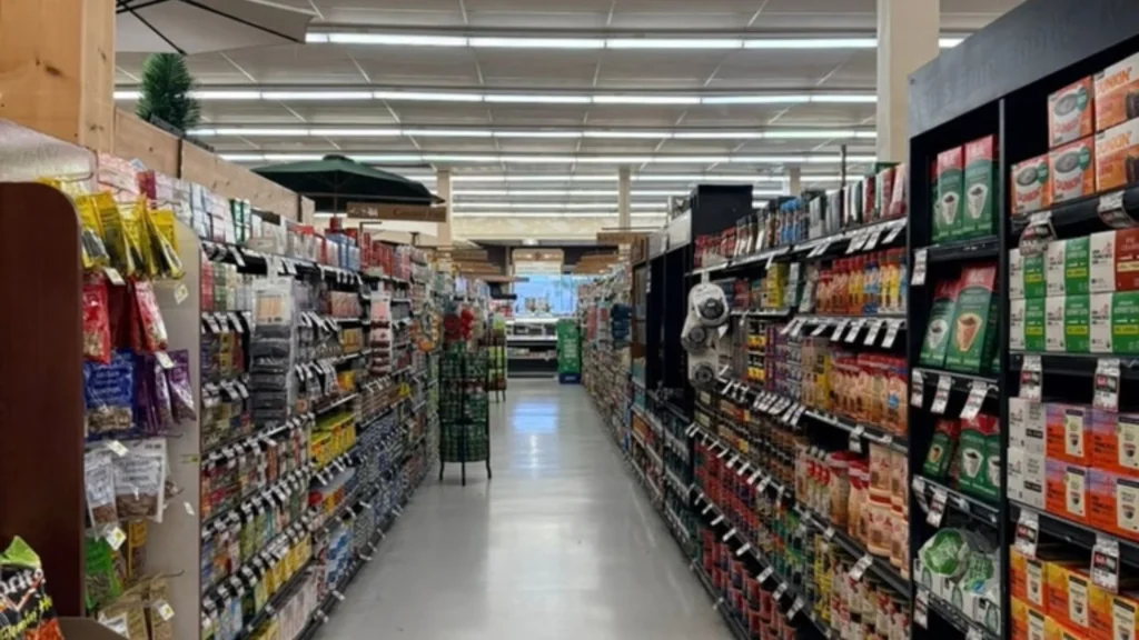 Long grocery aisle at Keil's with coffee and snacks on the shelves