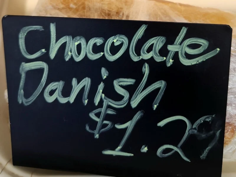 Chalkboard sign for chocolate danish at $1.29 in the bakery