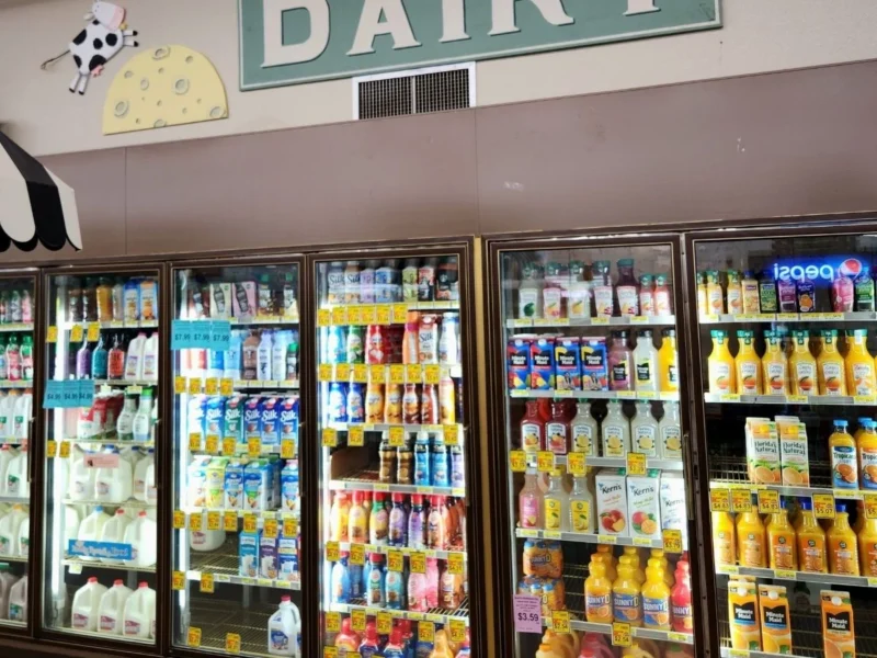Dairy cooler stocked with milk, juice and creamer