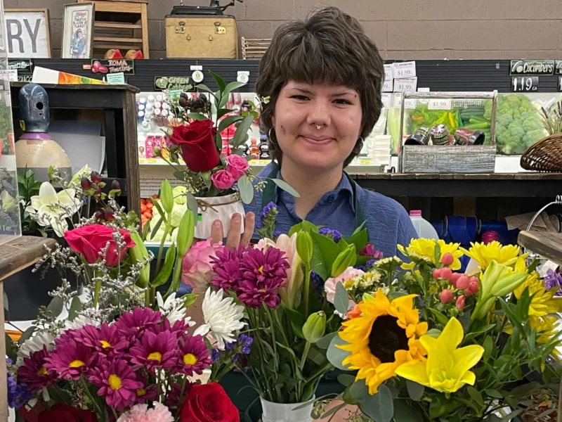 Smiling Norm's IGA florist with fresh bouquets of roses, sunflowers, lilies and daisies