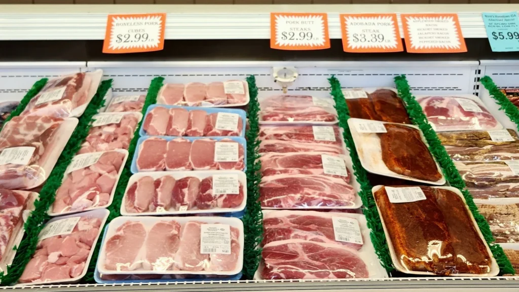 Fresh pork chops in the meat case