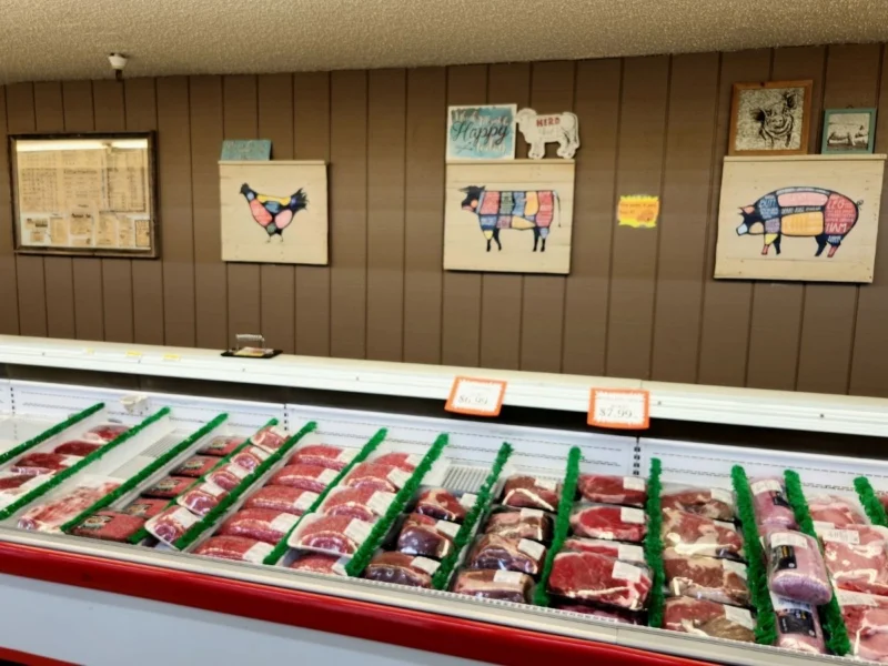 Fresh-cut meats lined up in the full-service meat case