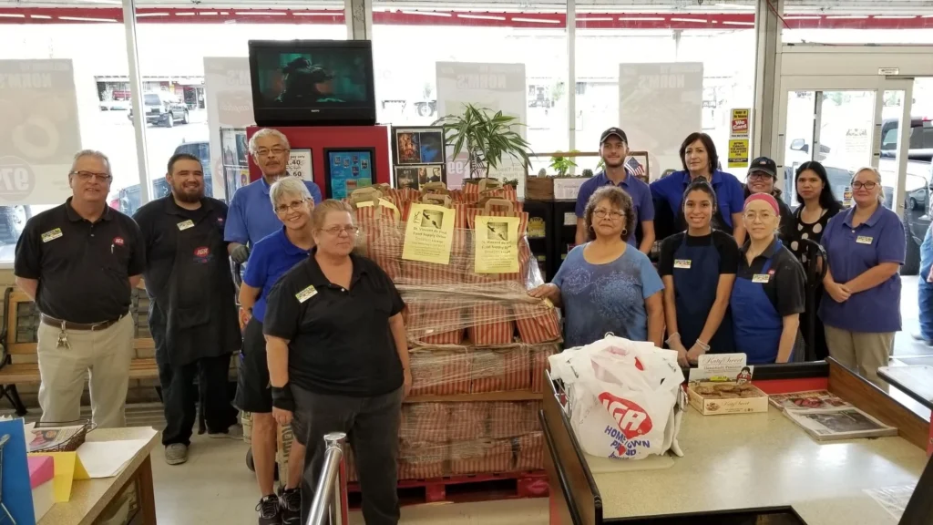 Norm's IGA team with St. Vincent de Paul Food Supply Drive donations