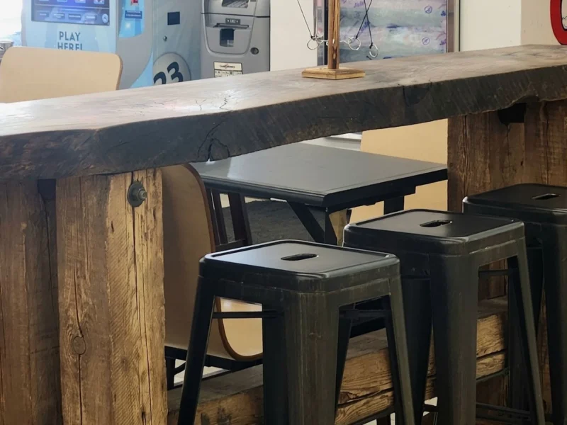 Wooden counter and stools in the indoor seating area
