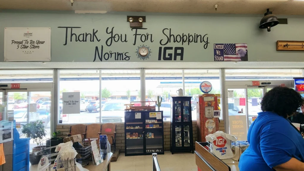 Thank You for Shopping Norm's IGA sign above the front lanes