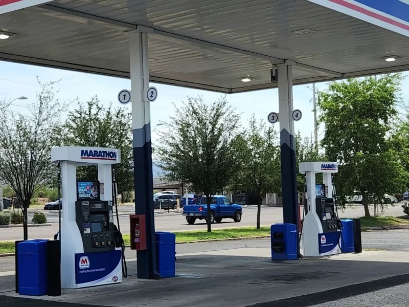 Marathon fuel pumps under the canopy in the Norm's IGA parking lot