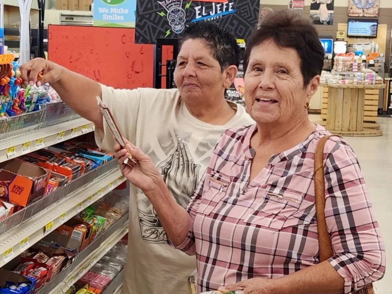 Two smiling shoppers in the aisle