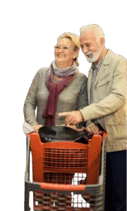 Senior couple shopping together with a grocery cart.
