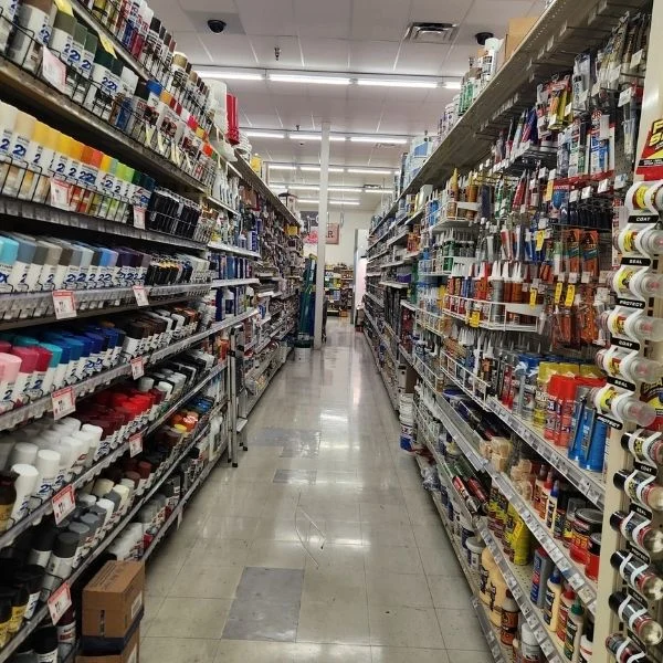 Long ACE Hardware aisle stocked with hardware and household supplies