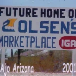 Sign reading Future Home of Olsens Marketplace IGA, Ajo Arizona