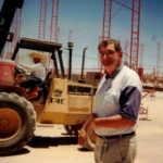 Historical photo of a man at the Olsens Marketplace construction site