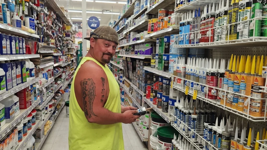 Customer shopping an aisle at the ACE Hardware inside Olsens Marketplace