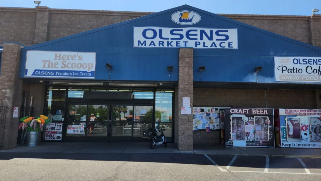 Olsens Marketplace IGA storefront with the Patio Cafe sign beside the entrance