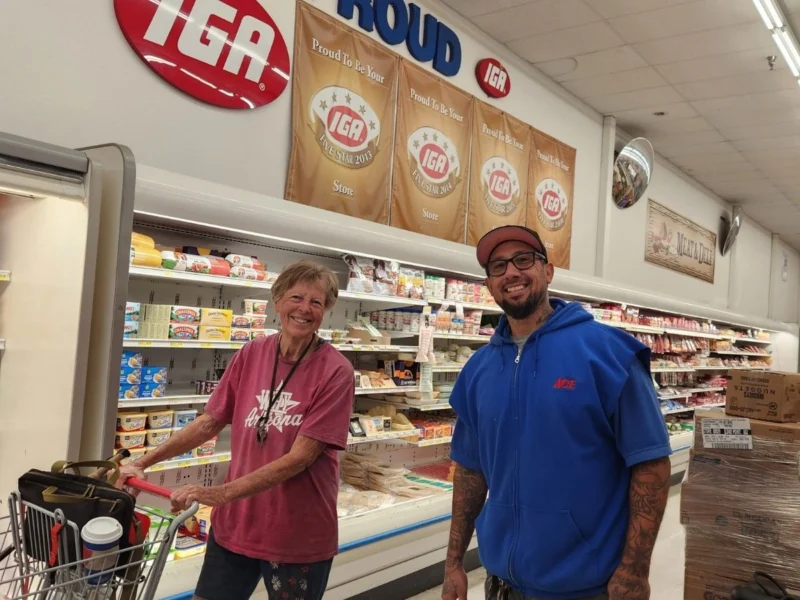 Meat Department Manager Bernie Alvarez helping a customer at the Olsens Marketplace meat counter