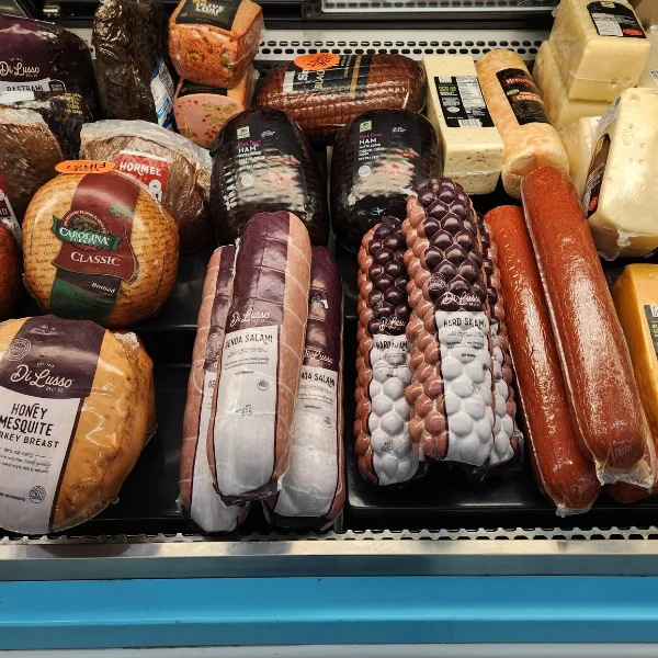 A variety of meats and cheeses available at the deli inside Olsens Marketplace.