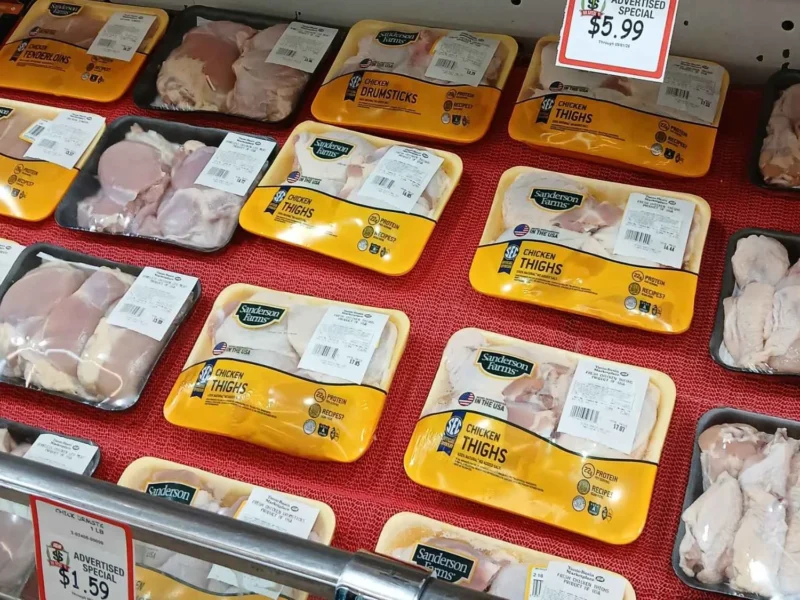 Packages of fresh chicken and pork in the meat case at Tonto Basin Market