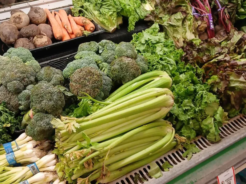 Broccoli, celery, green onions, carrots and leafy greens in the Tonto Basin Market produce case