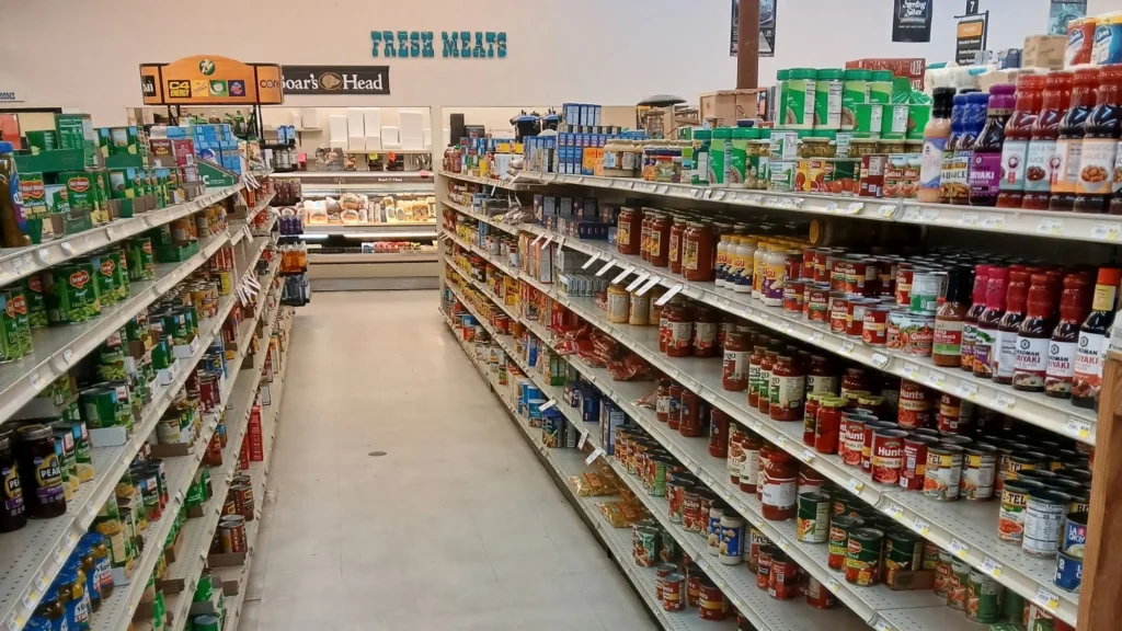 Grocery aisle of canned goods leading to the Fresh Meats department at Tonto Basin Market