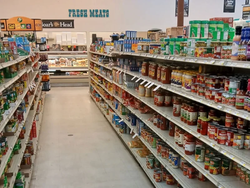 Grocery aisle of canned goods leading to the Fresh Meats department at Tonto Basin Market