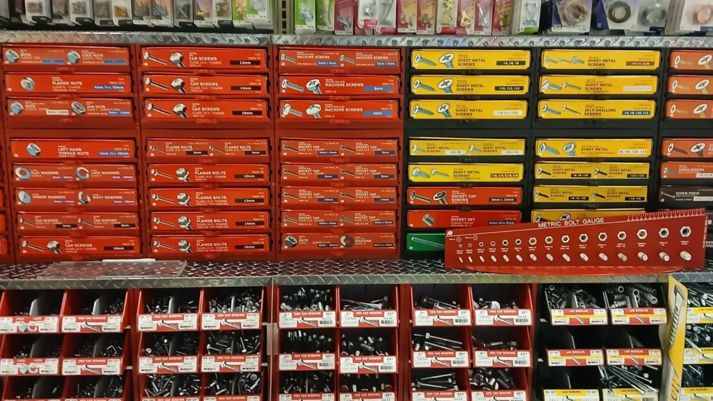 ACE Hardware aisle with bins of fasteners and hardware at Tonto Basin Market