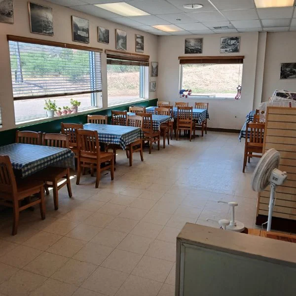 Deli dining room with checkered tablecloths and mountain views at Tonto Basin Market